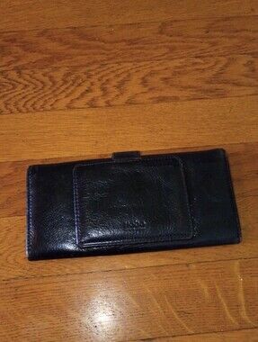 black leather hobo wallet with red lining and magnetic clasp